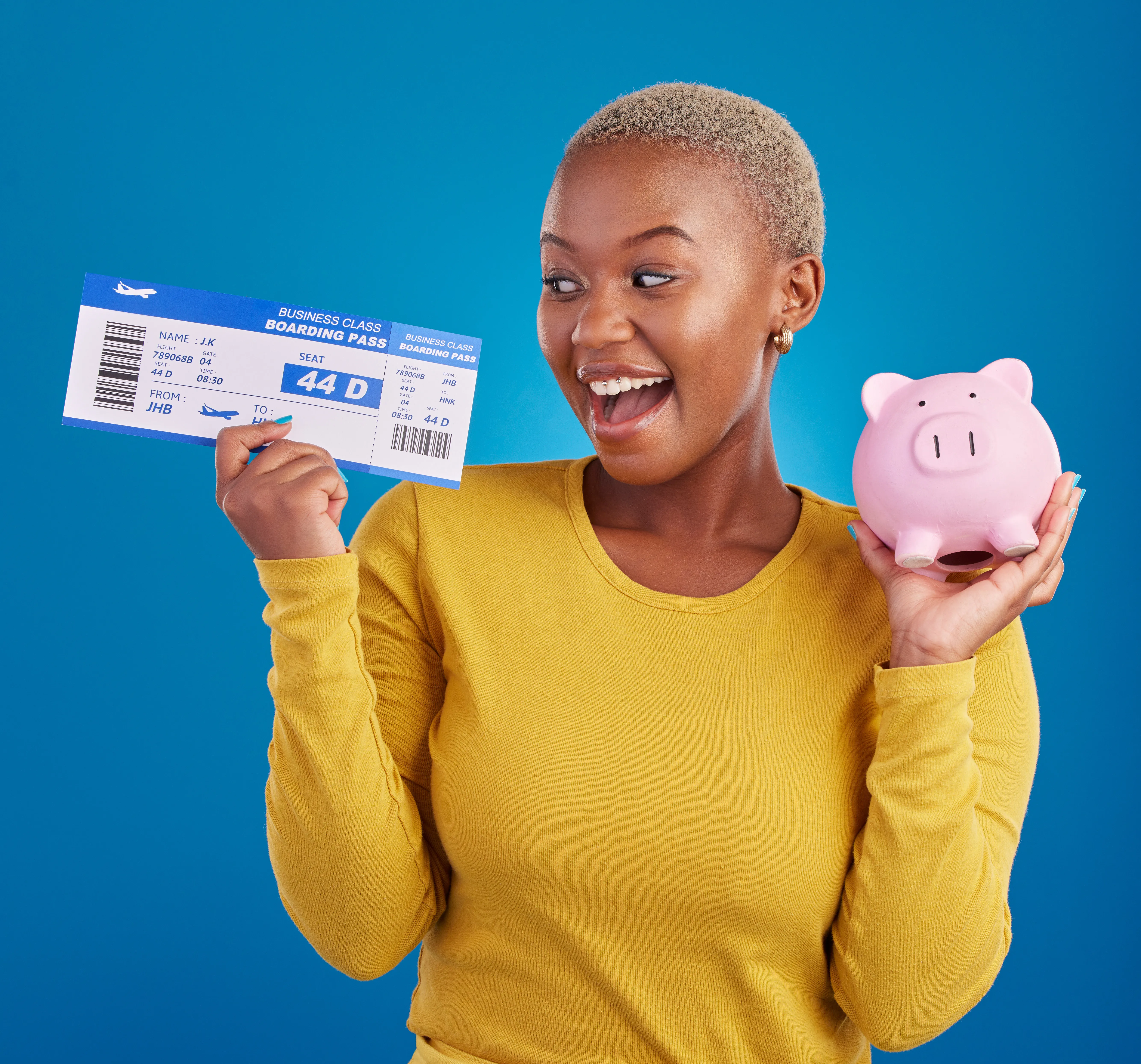 piggy bank travel tickets and black woman